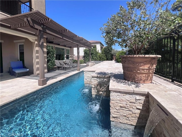 view of pool featuring a pergola, pool water feature, and a patio