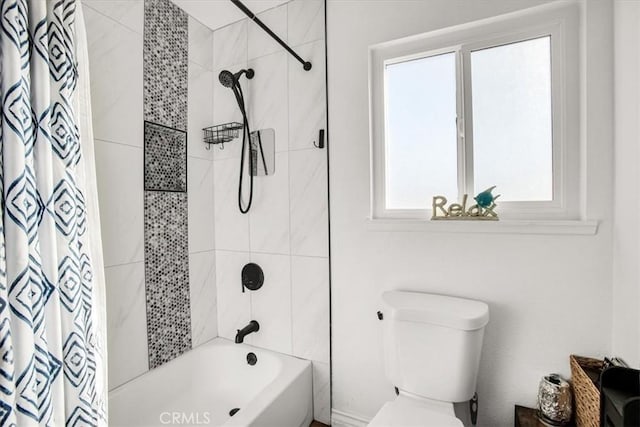 bathroom featuring toilet and shower / bathtub combination with curtain