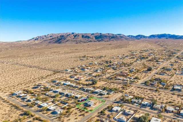 birds eye view of property featuring a mountain view