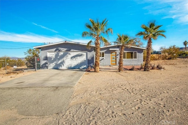 ranch-style home with a garage