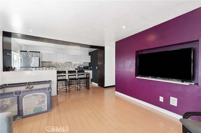 living room with light hardwood / wood-style floors