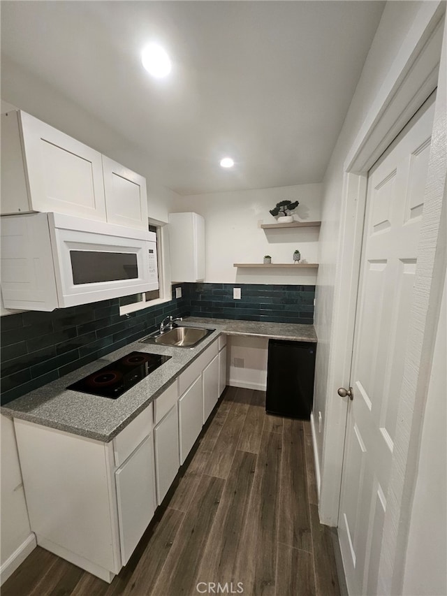 kitchen featuring dark hardwood / wood-style floors, black electric stovetop, decorative backsplash, sink, and white cabinets