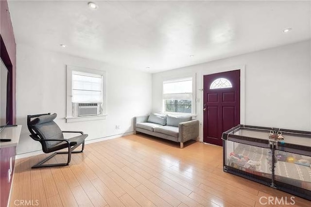 interior space featuring cooling unit and light hardwood / wood-style flooring