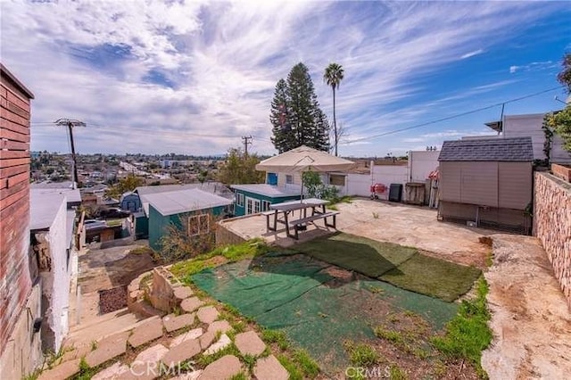 exterior space with a shed