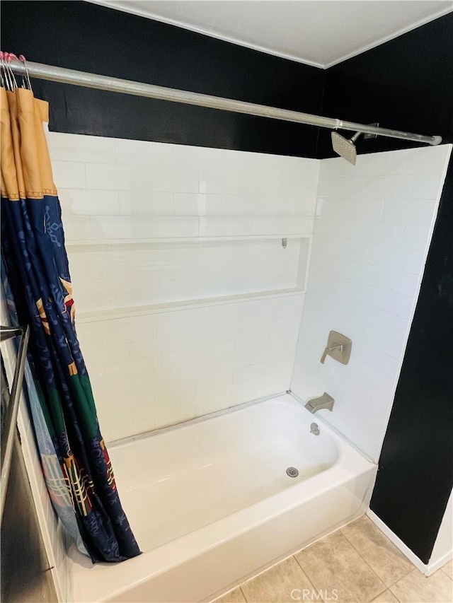 bathroom with shower / bath combination with curtain and tile patterned floors