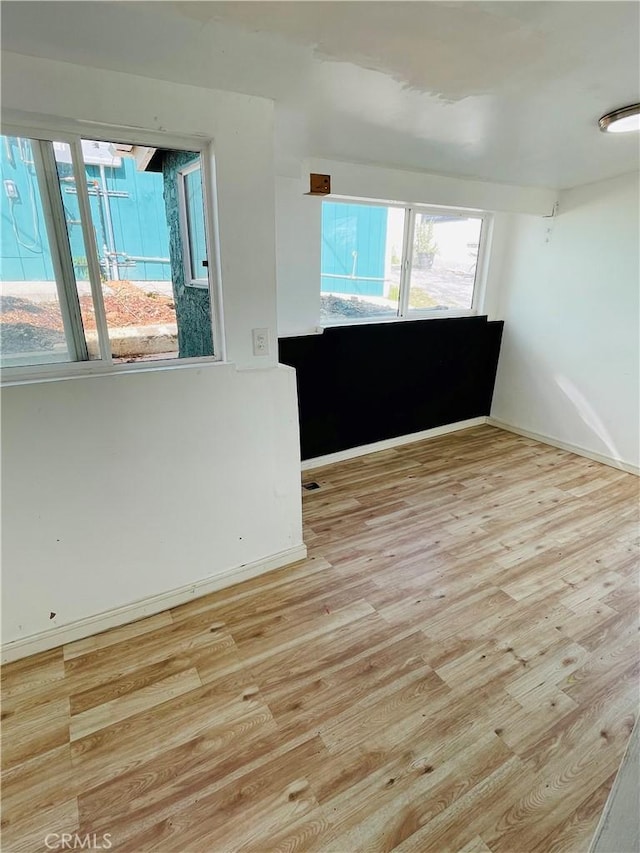 spare room with light wood finished floors