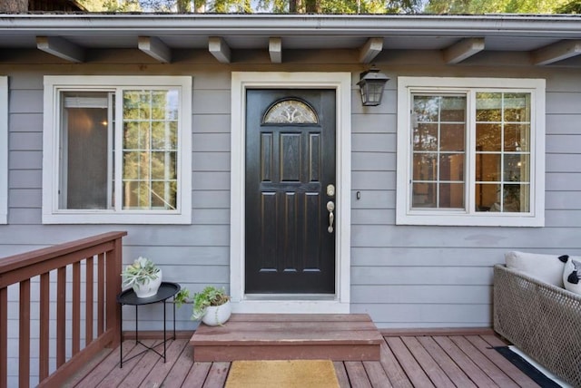 property entrance with a deck