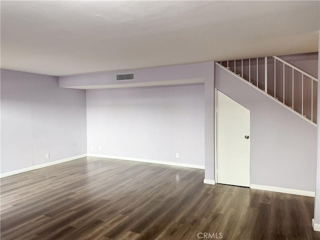 empty room featuring dark hardwood / wood-style floors