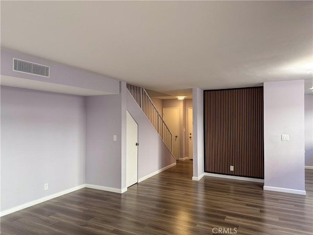 basement featuring dark wood-type flooring