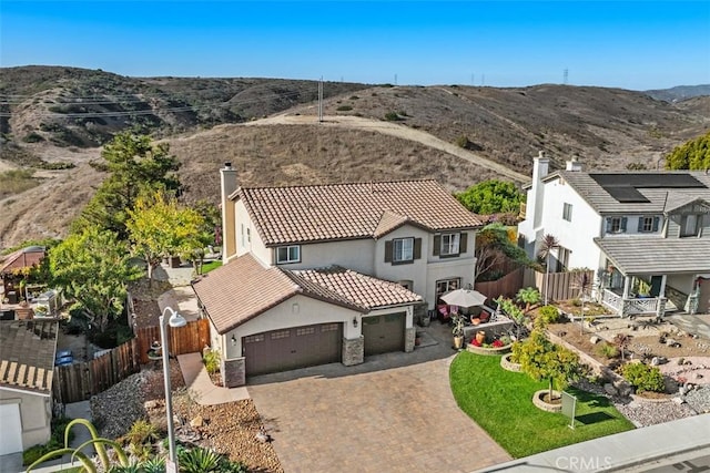 birds eye view of property featuring a mountain view