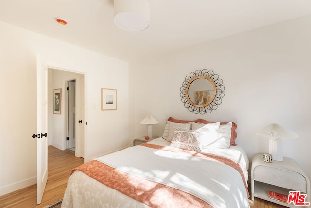 bedroom featuring hardwood / wood-style flooring