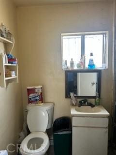 bathroom with vanity and toilet