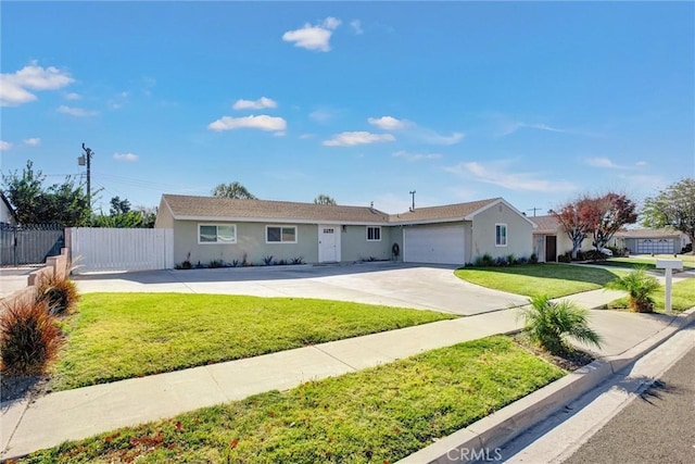 ranch-style house featuring a front yard and a garage