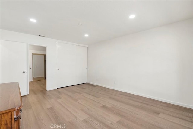 unfurnished room featuring light hardwood / wood-style floors