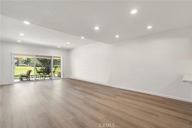 spare room with light wood-type flooring