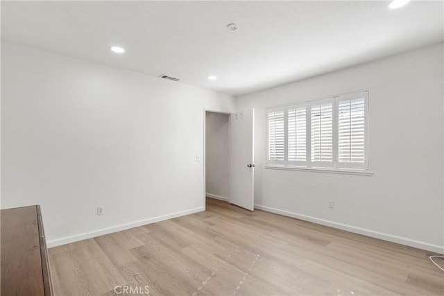 unfurnished room featuring light hardwood / wood-style flooring