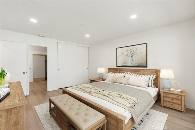 bedroom with light hardwood / wood-style flooring