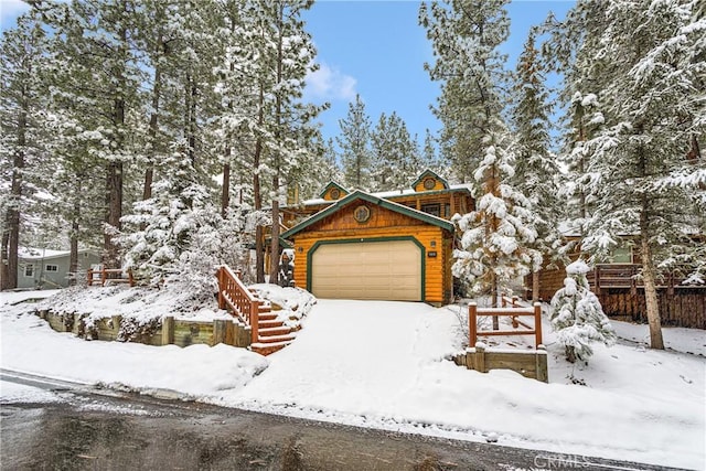 log-style house featuring a garage