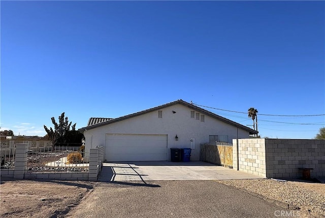 view of side of property featuring a garage