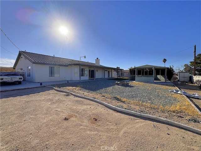 view of front of house featuring a sunroom