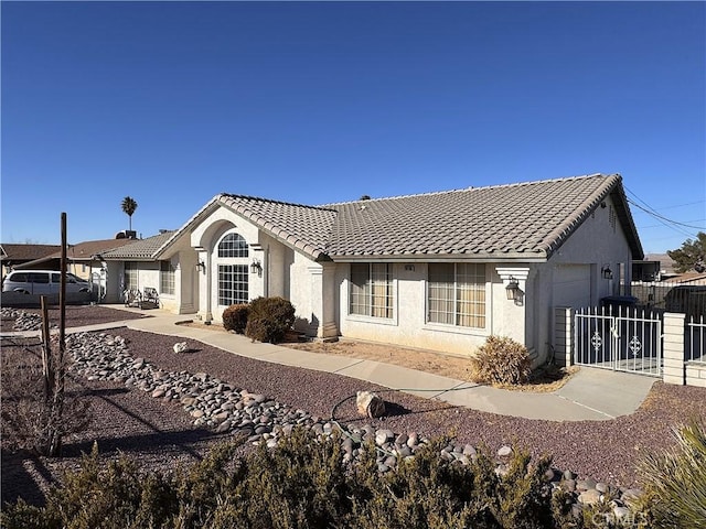 rear view of property featuring a garage