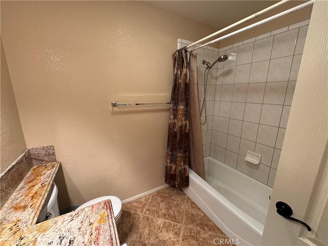 bathroom with tile patterned floors, shower / tub combo, and toilet