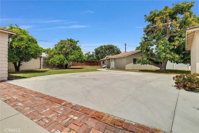 exterior space with a yard and basketball court