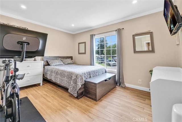 bedroom with crown molding and light wood-type flooring