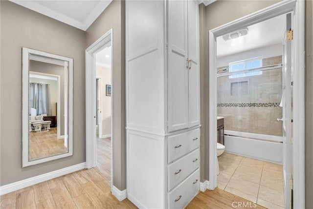 full bathroom featuring hardwood / wood-style floors, vanity, toilet, and enclosed tub / shower combo