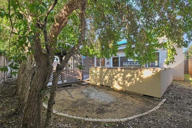 view of yard with a wooden deck