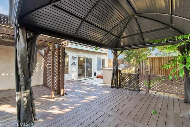 wooden terrace with a gazebo