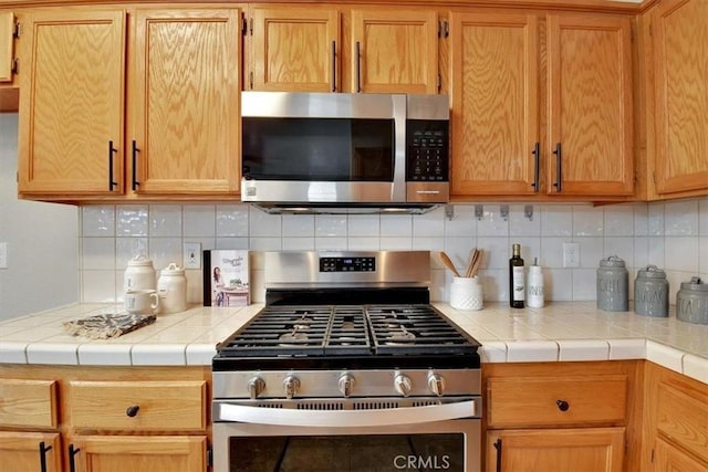 kitchen featuring backsplash and stainless steel appliances