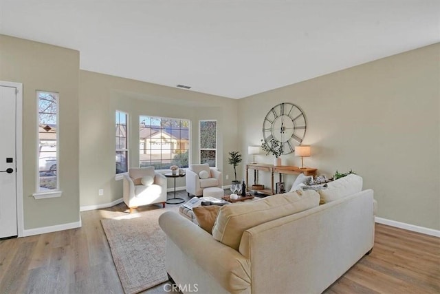 living room featuring light hardwood / wood-style flooring and plenty of natural light