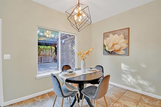 dining area with a notable chandelier