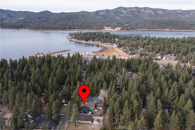 aerial view featuring a water and mountain view