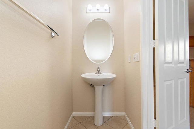 bathroom with tile patterned floors