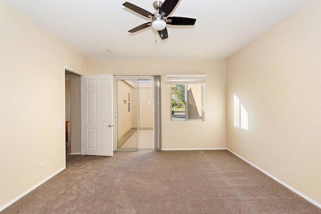 empty room with carpet flooring and ceiling fan