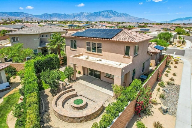 birds eye view of property with a mountain view