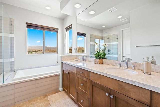 bathroom with tile patterned floors, vanity, and plus walk in shower