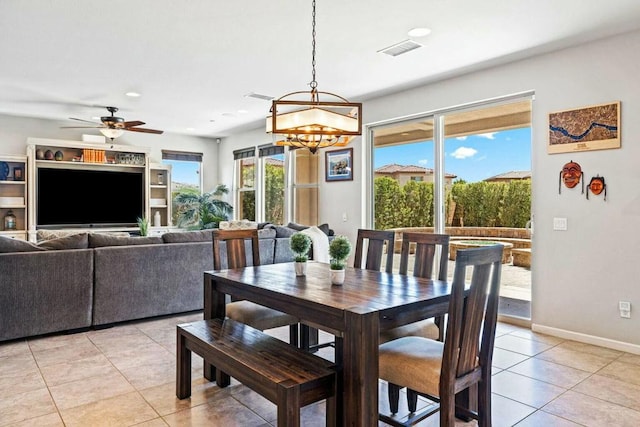 tiled dining room with ceiling fan