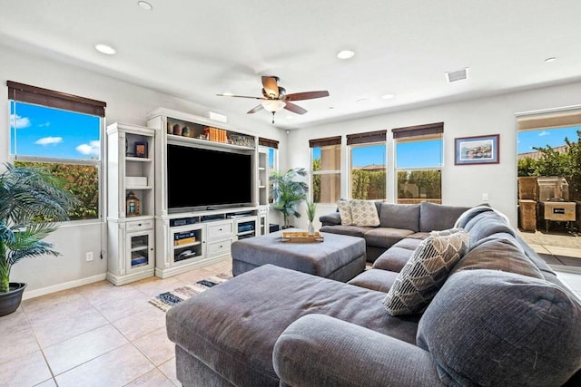 tiled living room featuring ceiling fan