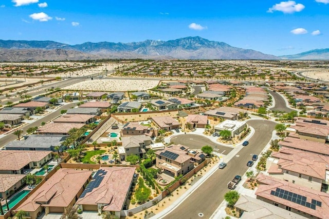 birds eye view of property with a mountain view