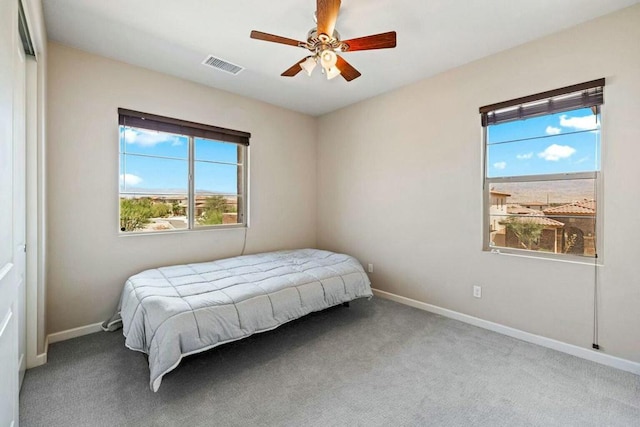 carpeted bedroom featuring ceiling fan