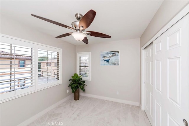 interior space featuring ceiling fan