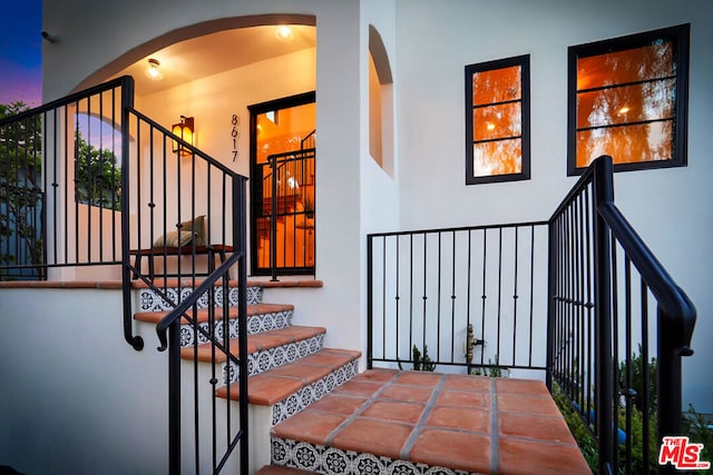 stairs featuring a high ceiling