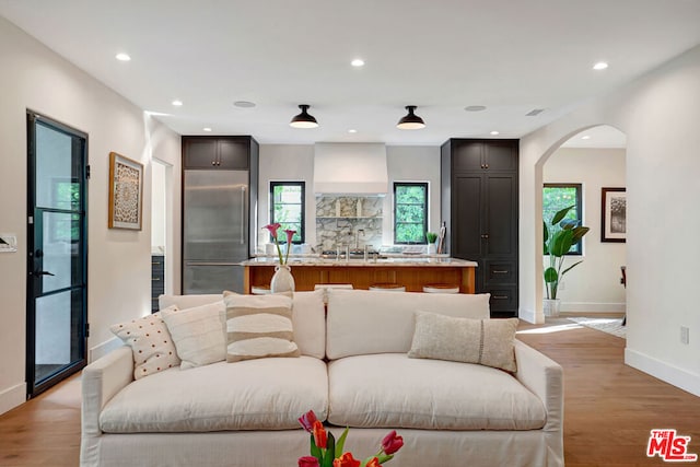 living room with light hardwood / wood-style flooring