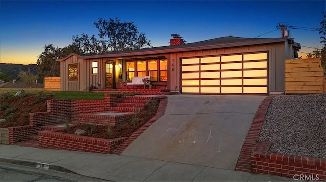 view of front of home with a garage