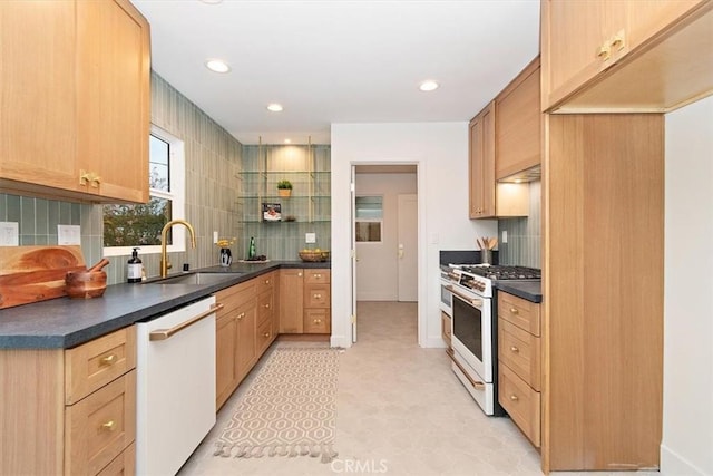 kitchen with light brown cabinets, white appliances, backsplash, and sink