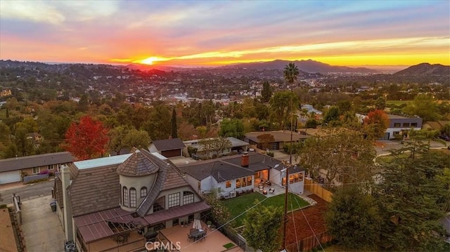 aerial view at dusk with a mountain view