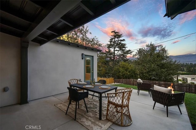 view of patio terrace at dusk